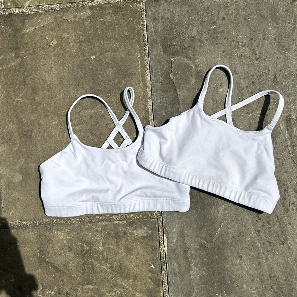 Two white athleta girl bras